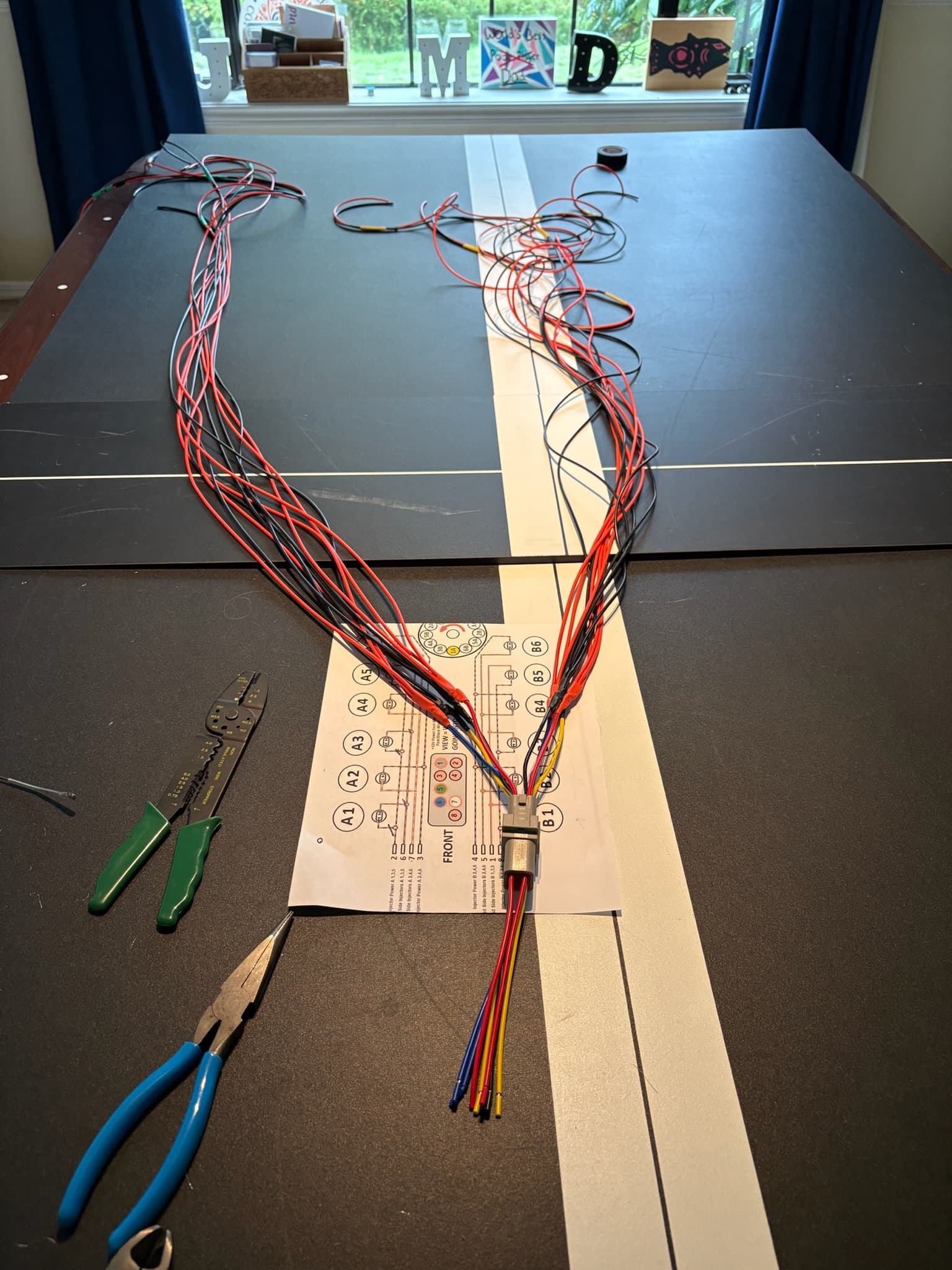 NOAD Lights told me only 6 of the 12 cylinders had a spark. Removing the compressor shows frayed/chewed cables on the wiring harness ... we need a new harness!