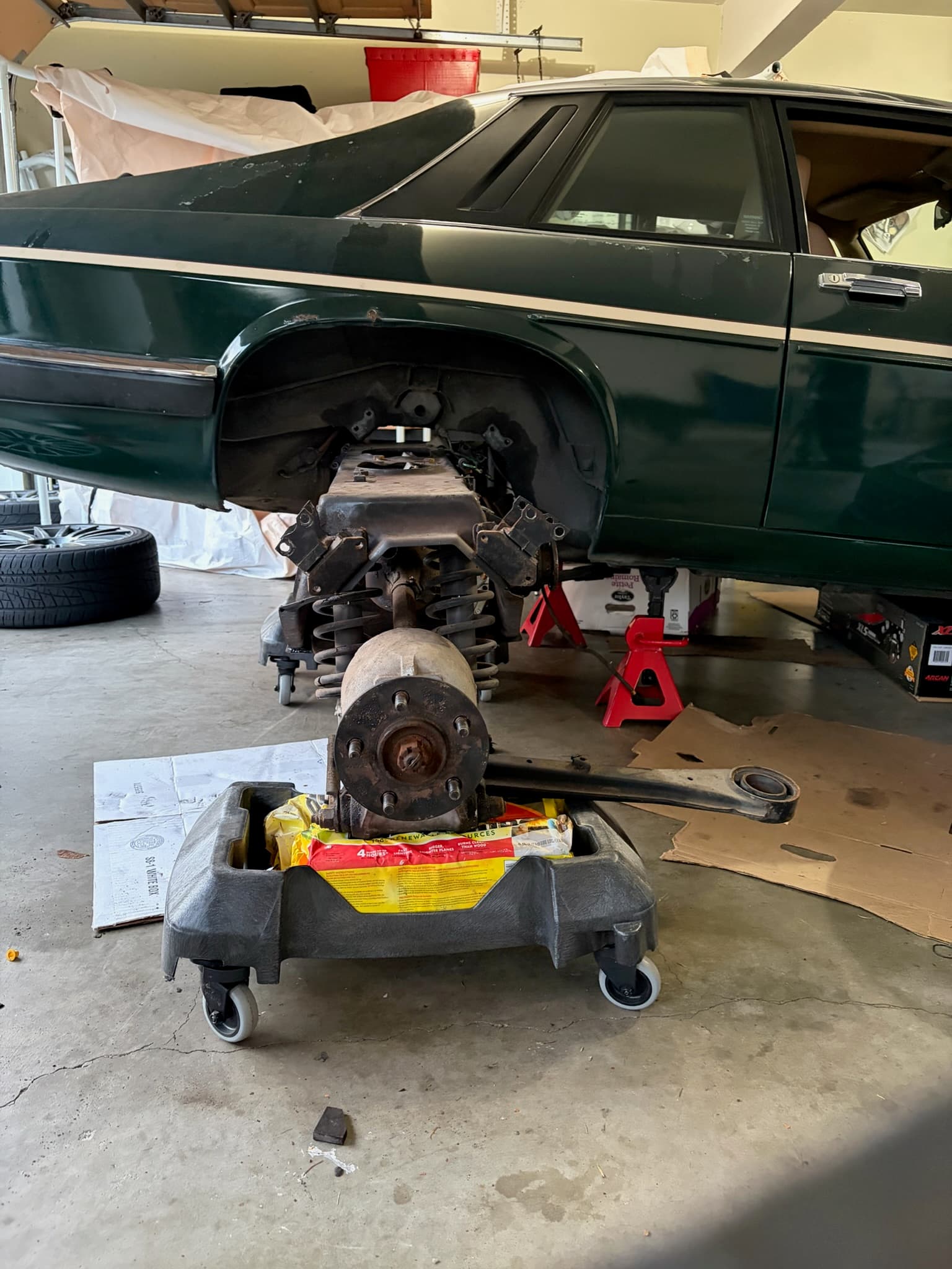 Slowly maneuvering subframe back into place before jacking up.